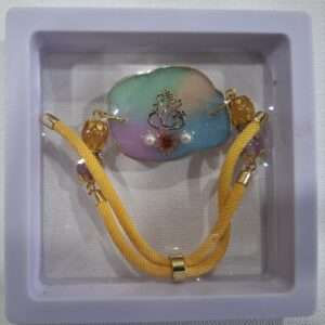 Rakhi cum Bracelet – Pastel Ganesha with Yellow rope